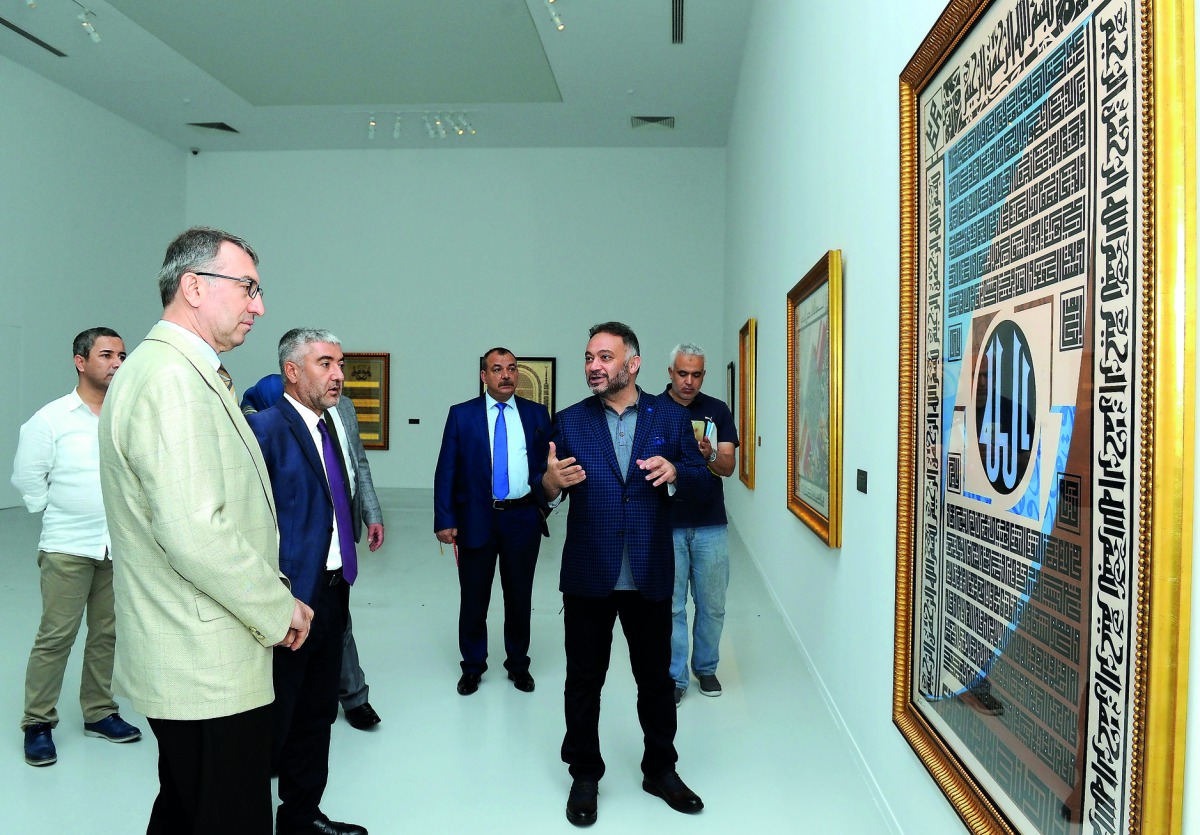 Mehmet Cebi, with other officials at the exhibition of his Contemporary Calligraphy collections at the MIA Al Riwaq in Doha, yesterday. Pic: Salim Matramkot/The Peninsula