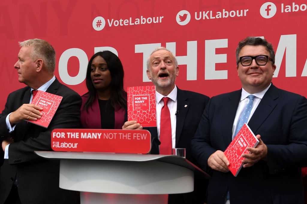 (L-R) Ian Lavery, Labour elections and campaign coordinator, Kate Osamor, Shadow minister for international developement, British opposition Labour party leader Jeremy Corbyn and deputy leader Tom Watson pose with copies of the Labour election manifesto a