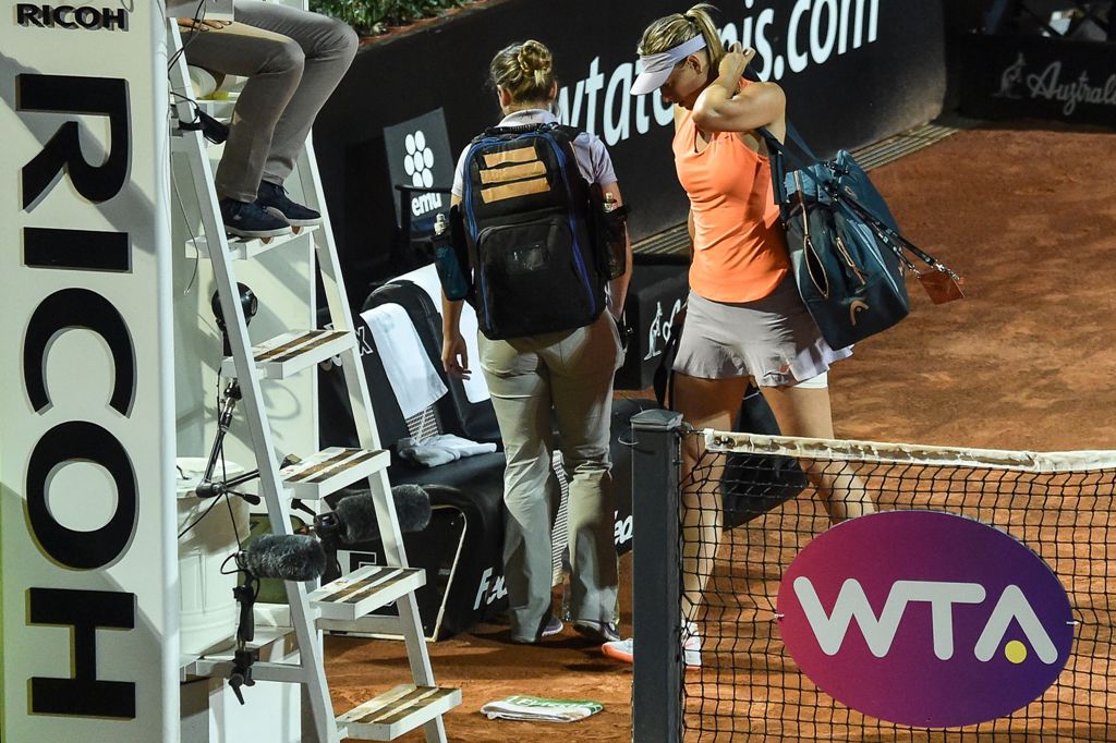 Russia's Maria Sharapova leaves the court during her match against Mirjana Lucic-Baroni of Croatia at the Rome ATP Tennis Open tournament on May 16, 2017 at the Foro Italico in Rome. Mirjana Lucic-Baroni beat Maria Sharapova 6-4, 3-6, 1-2. / AFP / ANDREAS