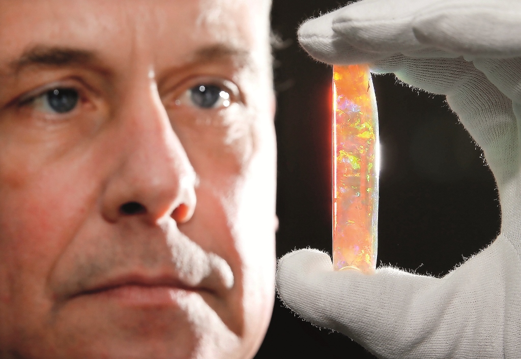 South Australian Museum Director Brian Oldman with the A$1m Virgin Rainbow opal — one of the highlights of the exhibition.