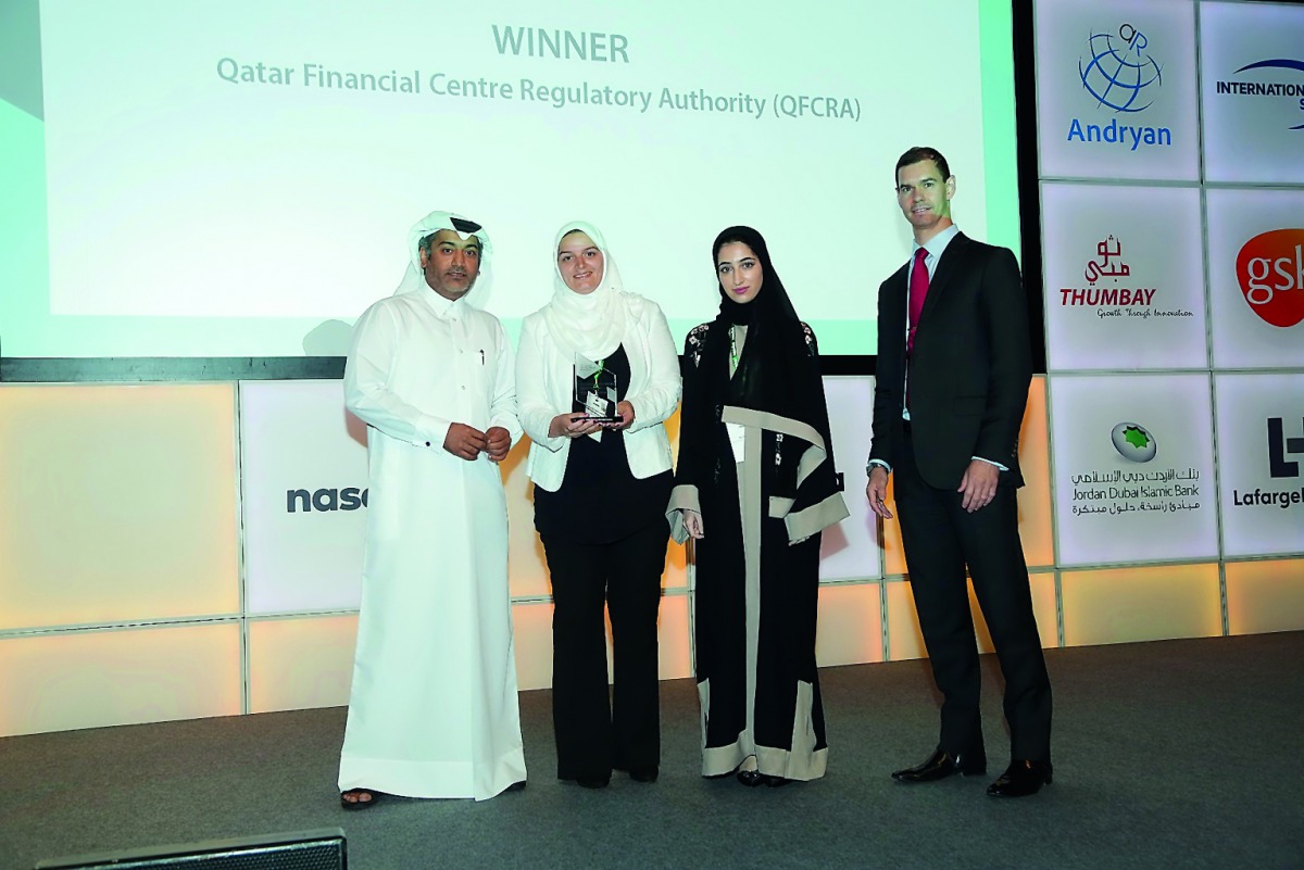 From Left:  Eisa Ahmed Abdulla, COO and Managing Director, Corporate Services; Najat El Mahdy, Head of Organisational Development; and Wadha Al Jaber, Associate, Human Resources, all from the QFC Regulatory Authority, receiving the “Best Nationalisation I