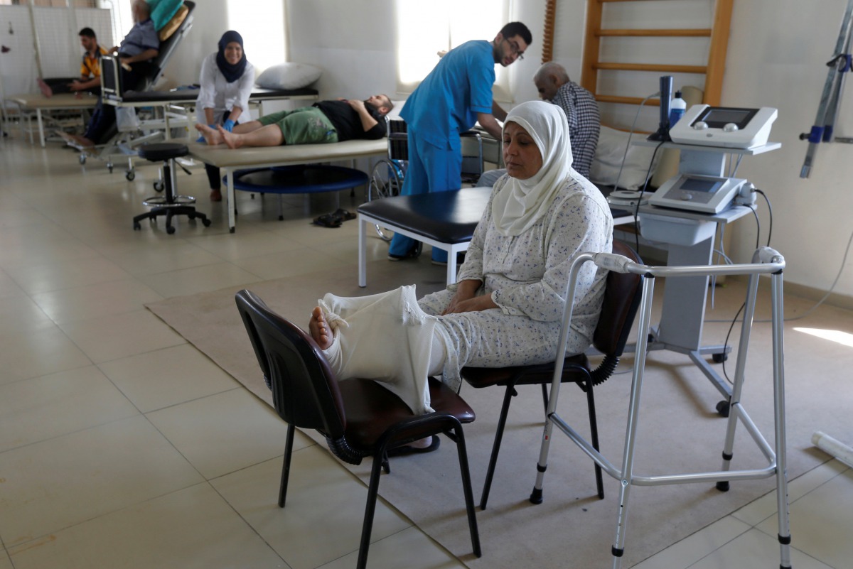 A woman, who was wounded in Syria, rests inside a hospital in Tripoli, Lebanon May 23, 2017. Picture taken May 23, 2017.REUTERS/Mohamed Azakir