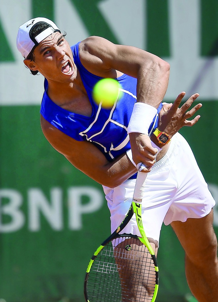 Spain's Rafael Nadal serves during a practice session on the eve of the first round of the French Open tennis tournament in Paris, yesterday.