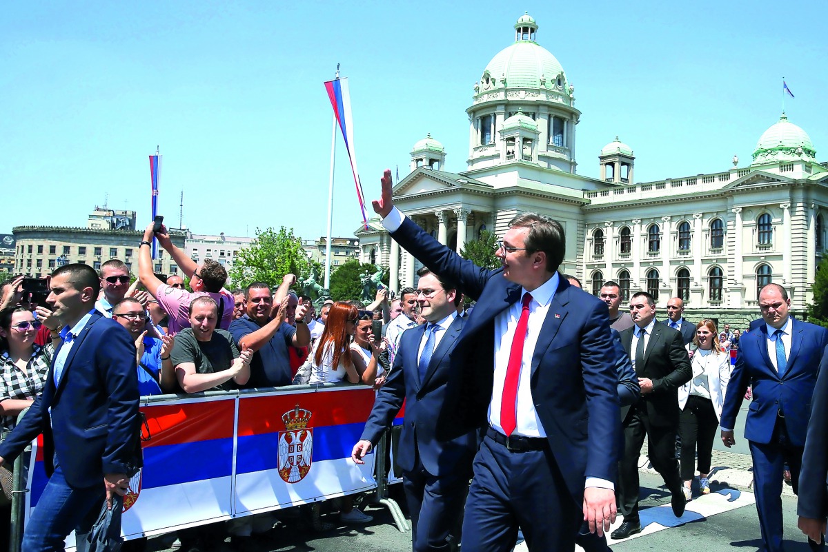 Newly elected Serbian President Aleksandar Vucic waves to his supporters after a swearing-in ceremony at the parliament building in Belgrade, Serbia May 31, 2017. REUTERS/Marko Djurica