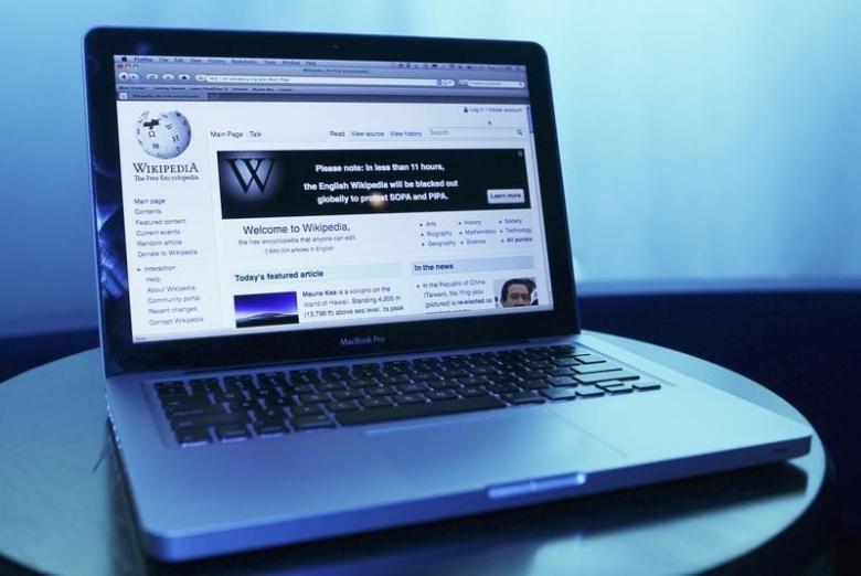 A Wikipedia webpage in use on a laptop computer is seen in Washington, January 17, 2012 (REUTERS / Gary Cameron) 