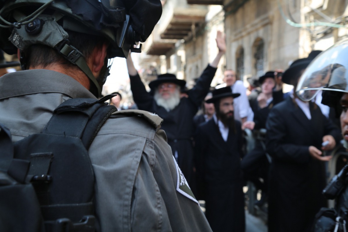 Ultra Orthodox Jewish people stage a protest against compulsory military service in Jerusalem on June 4, 2017. Ultra Orthodox Jewish people believe that young people doing military service can commit sin due to external factors. (Israeli Police Department
