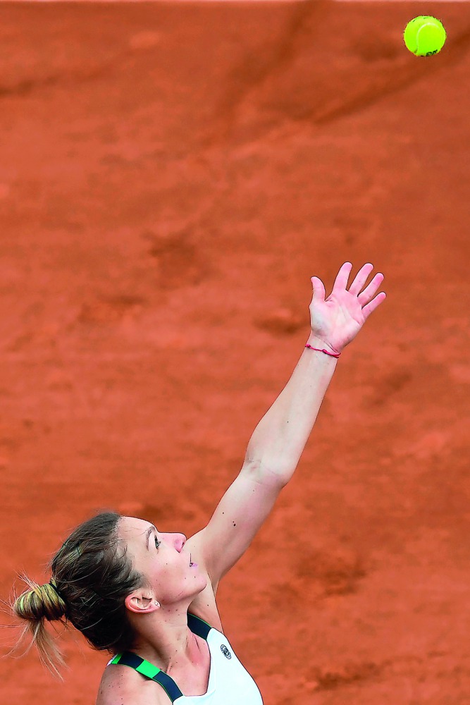 Romania's Simona Halep serves the ball to Czech Republic's Karolina Pliskova during their semi-final match at the Roland Garros 2017 French Open on Thursday.