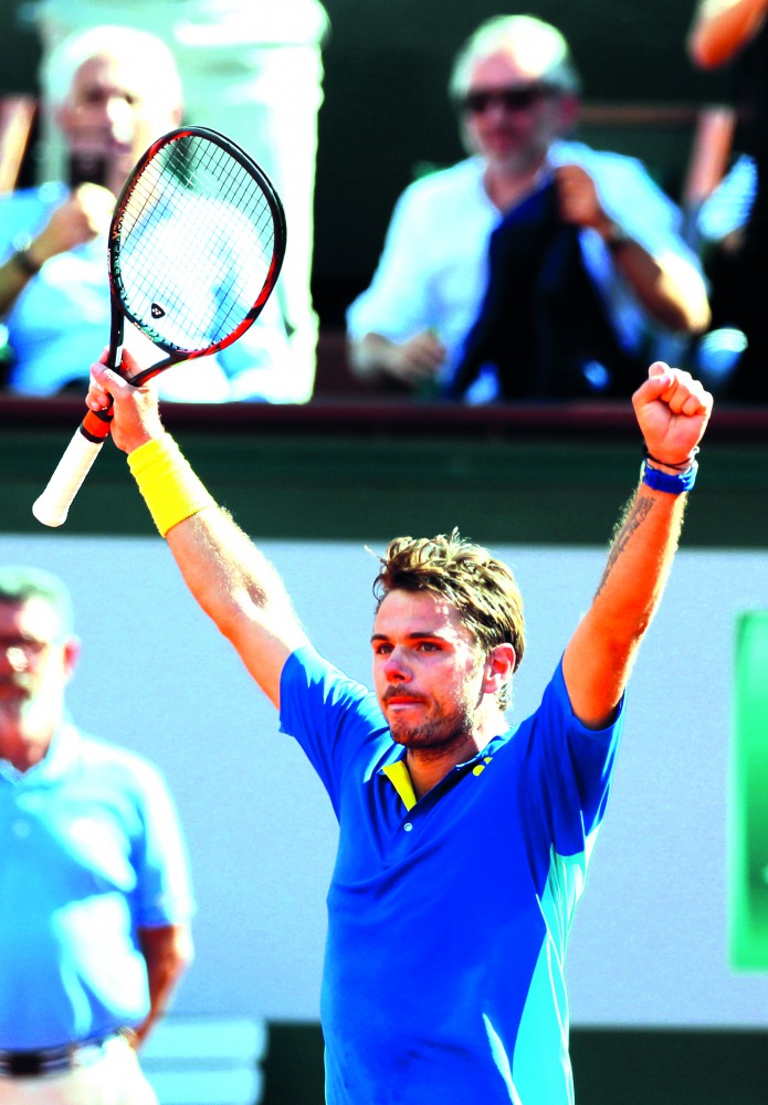 Switzerland’s Stan Wawrinka celebrates winning his semi-final match against Great Britain’s Andy Murray.