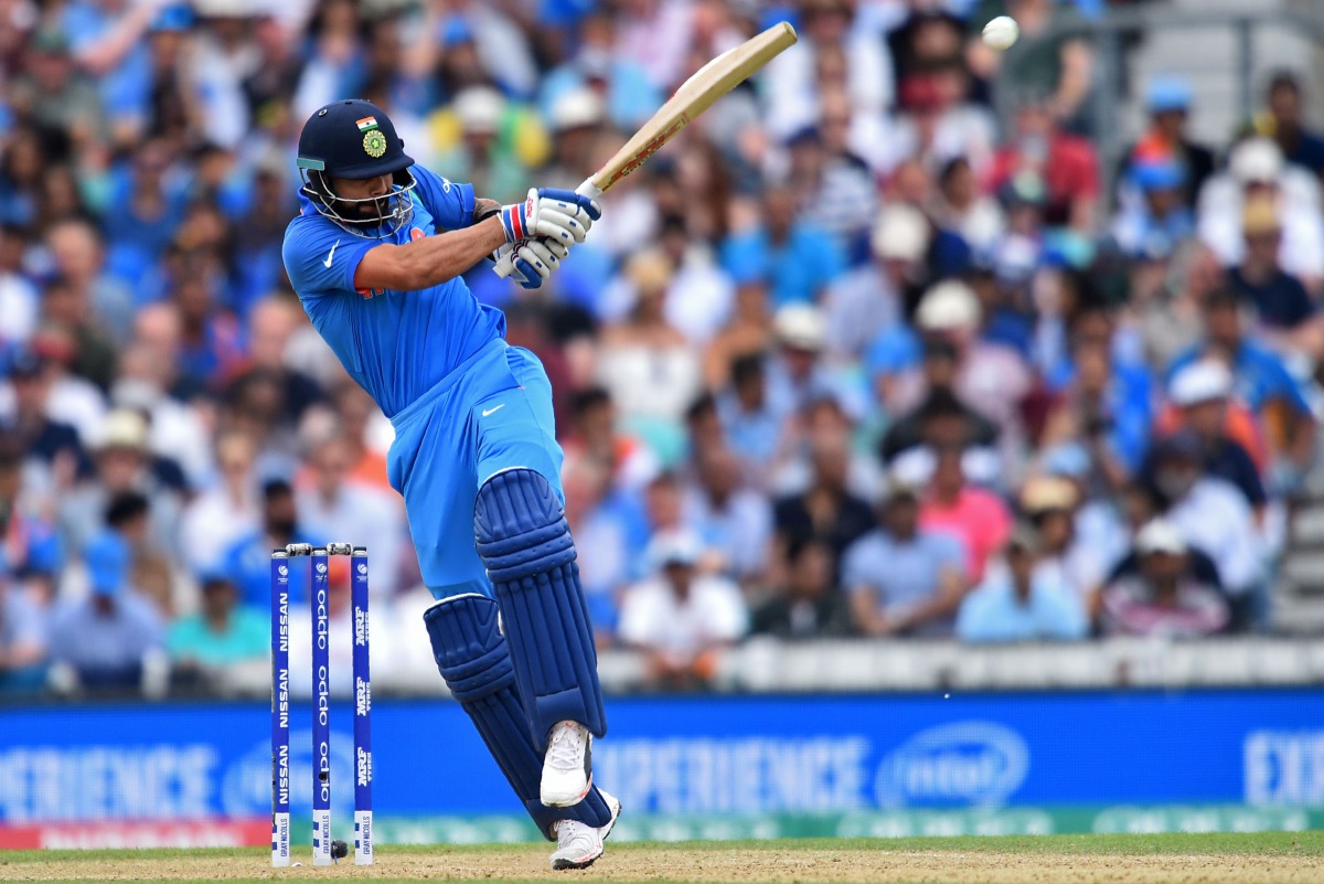 India's captain Virat Kohli playing a shot during the ICC Champions Trophy match between South Africa and India at The Oval in London. ( AFP / Glyn KIRK)