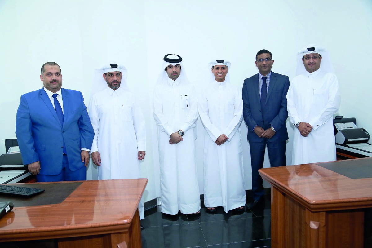 Senior officials from the Ministry of Justice (MoJ) and QIB during the opening ceremony at QIB headquarters in Grand Hamad Street. 