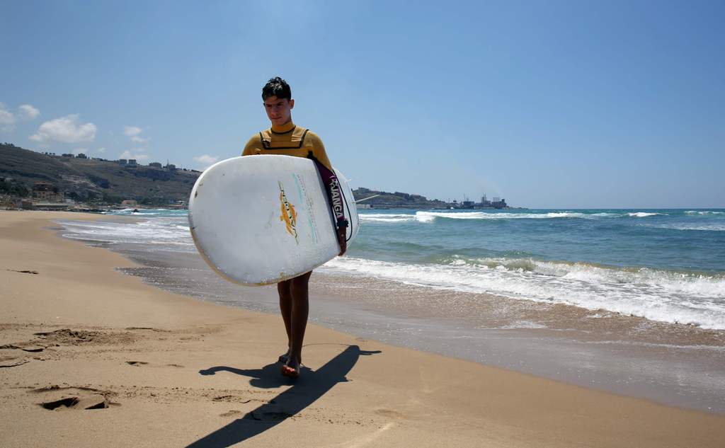 Ali Kassem, a 17-year-old Syrian refugee on a beach in the town of Jiyeh, south of the Lebanese capital Beirut, May 24, 2017. — Reuters Pictures