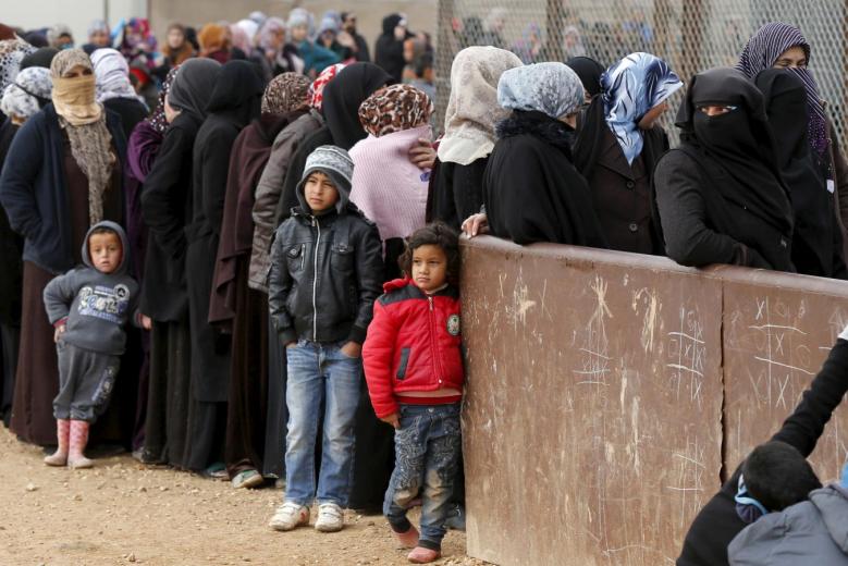 File picture of syrian refugees waiting for aid packages at Al Zaatari refugee camp in the Jordanian city of Mafraq, near the border with Syria, January 20, 2016. Reuters
