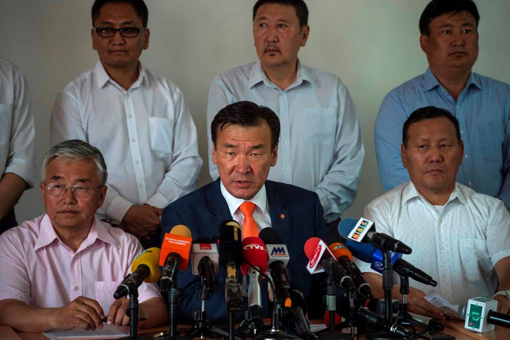 Presidential candidate Sainkhuu Ganbaatar (C), from the Mongolian People?s Revolutionary Party (MPRP) speaks during a press conference at his headquarters in Ulan Bator on June 27, 2017. AFP / FRED DUFOUR