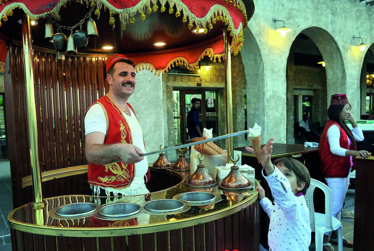Children enjoy Eid activities at the Souq Waqif, yesterday. Pic:  Kammutty VP / The Peninsula