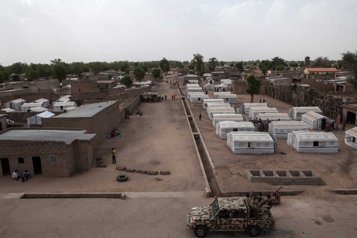 This file photo taken on April 26, 2017 shows a Nigerian army vehicle patrolling a street in the town of Banki, northeastern Nigeria. Nigerians who fled to northern Cameroon after attacks of Boko Haram insurgents are flowing back into northeastern Nigeria