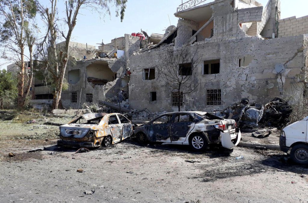 Damaged cars are seen at one of the blast sites in Damascus in this handout picture posted on SANA on July 2, 2017, Syria. / Reuters.