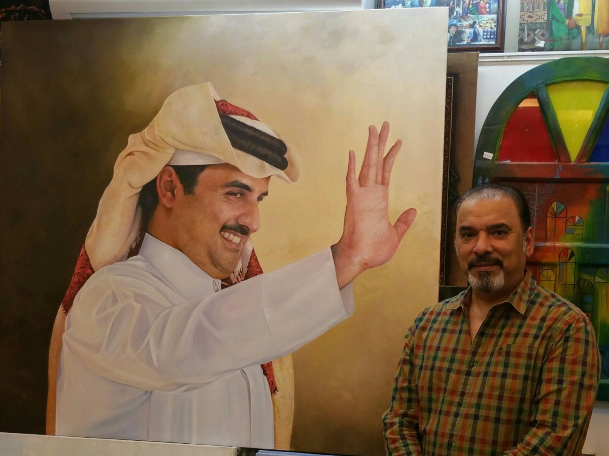 Bilal AlDori with one of his works