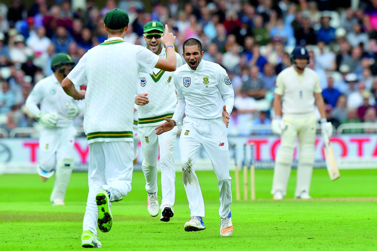 South Africa’s Keshav Maharaj (centre) celebrates bowling England’s Jonny Bairstow (right) for 45 runs on the second day of their second Test at Trent Bridge cricket ground in Nottingham, central England, yesterday. 