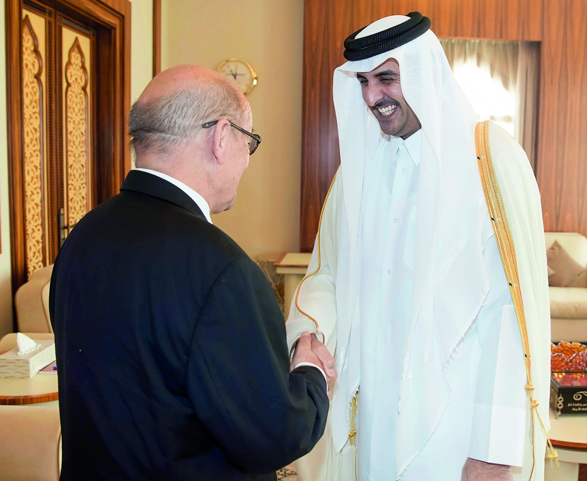Emir H H Sheikh Tamim bin Hamad Al Thani with French Minister for Europe and Foreign Affairs Jean-Yves Le Drian at Al Bahr Palace yesterday. 