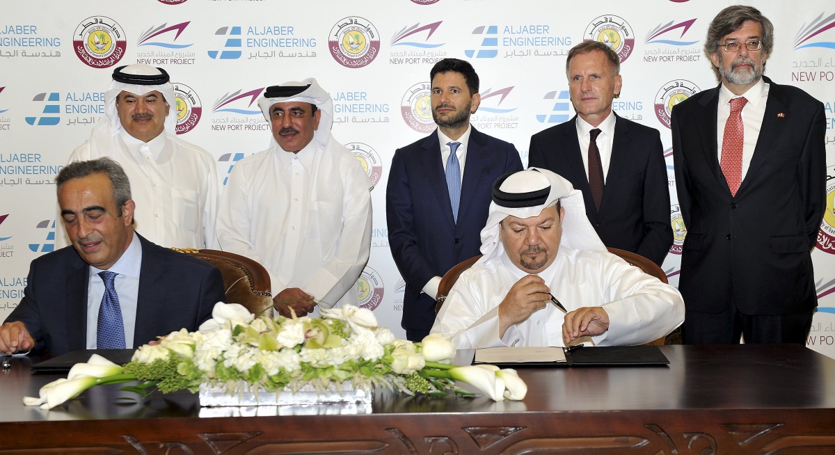 The New Port Project Executive Director, Maisar Jamil El Qutami (third right) and CEO of the Al Jaber Engineering, Osama Hadid ( left) at the signing ceremony, in the presence of the Minister of Transport and Communications, Jassim Saif Ahmed Al Sulaiti, 