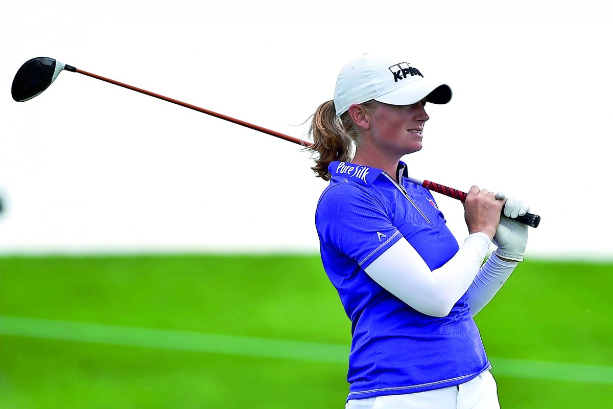 Stacy Lewis of the US reacts after teeing off on the 11th hole during the third round of the US Women’s Open golf tournament at Trump National Golf Club-New Jersey on Saturday.