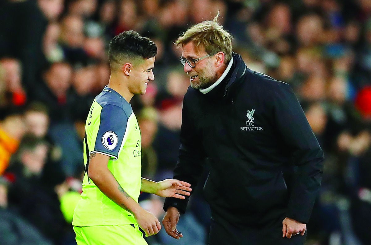 Liverpool’s Philippe Coutinho (left) speaks with manager Juergen Klopp during an EFL Cup match at St Mary’s Stadium, in Southampton, England in this file photo. 