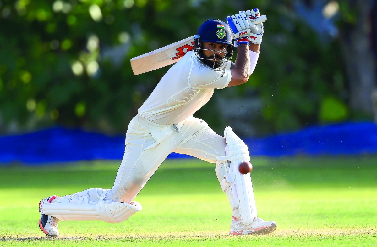 Indian captain Virat Kohli plays a shot during the first day of the two-day warm-up match against Sri Lanka Board President’s XI at the Colombo Cricket Club Stadium in Colombo, yesterday.  India will play three Tests, five one-day internationals and a Twe