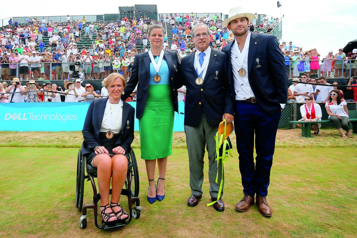 The 2017 inductees into the International Tennis Hall of Fame (From left) Monique Kalkman van den Bosch of the Netherlands, Kim Clijsters of Belgium, journalist Steve Flink of the US and Andy Roddick of the US pose for photographs after ceremonies in Newp