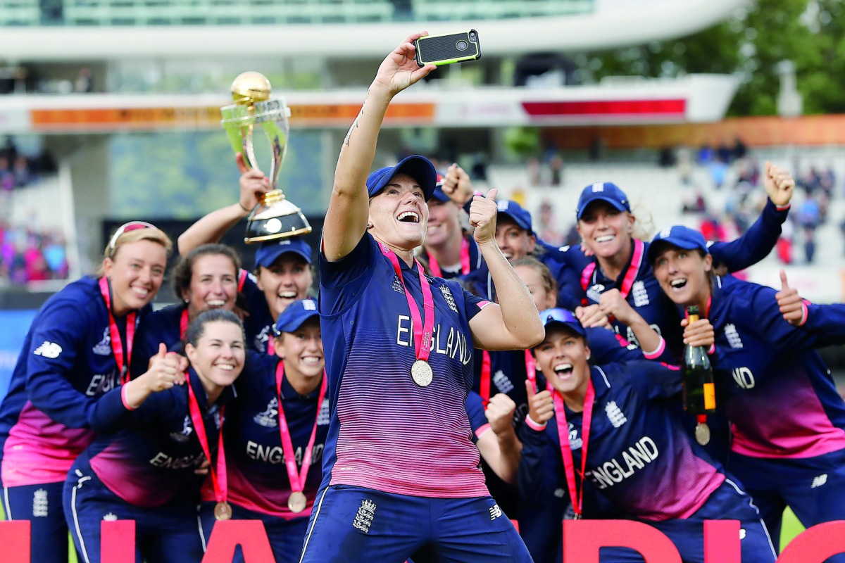 England players pose after winning the ICC Women’s World Cup final against India at Lord’s cricket ground in London, yesterday. 
