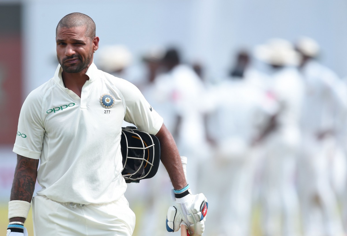 Indian batsman Shikhar Dhawan leaves the pitch after being dismissed during the first day of the first Test match between Sri Lanka and India at Galle International Cricket Stadium in Galle on July 26, 2017. (AFP / ISHARA S. KODIKARA)