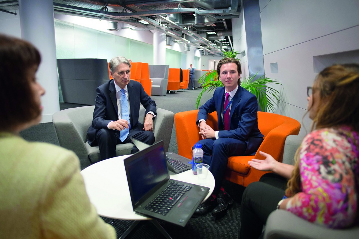Britain’s Chancellor of the Exchequer Philip Hammond (second left) meets staff as he tours the IBM office in London, yesterday, as the preliminary estimates for 2017 second-quarter GDP are published. UK’s GDP grew by 0.3 percent between April and June, a 
