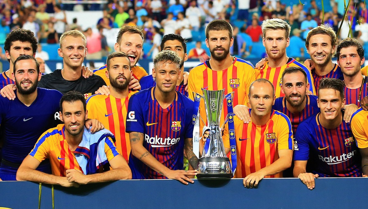 Barcelona celebrate with the trophy after defeating Real Madrid 3 to 2 in their International Champions Cup 2017 match at Hard Rock Stadium on July 29, 2017 in Miami Gardens, Florida. (Chris Trotman/Getty Images/AFP)