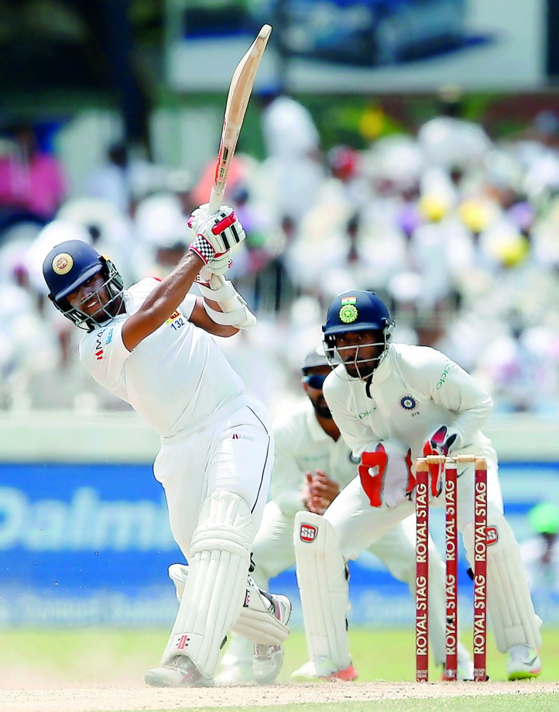 Sri Lankan batsman Kusal Mendis hits a boundary on the third day of their second Test match at the Sinhalese Sports Club Grounds in Colombo , Sri Lanka yesterday. Mendis smashed a belligerent 110 to lead the hosts’ fight back as they reduced India’s lead 