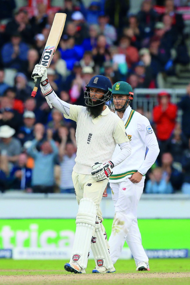 England’s Moeen Ali celebrates his half century on the third day of the fourth Test match between England and South Africa at Old Trafford in Manchester yesterday.