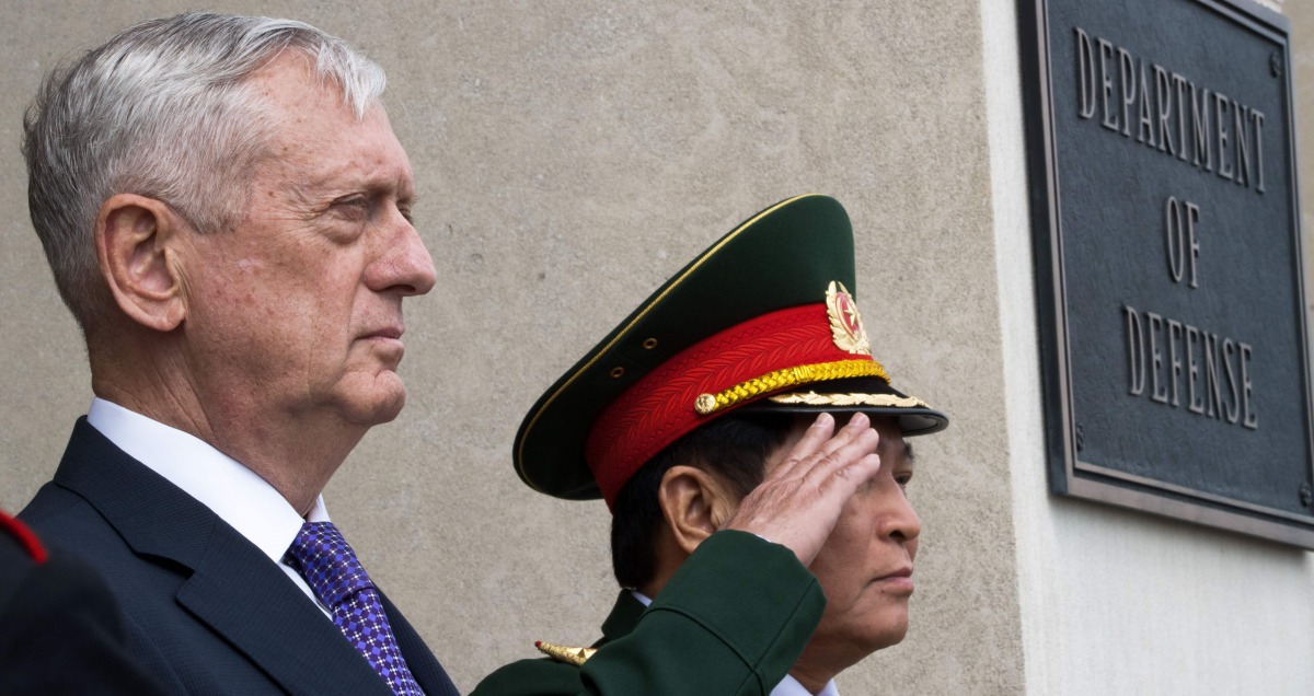 This file photo taken on August 08, 2017 shows US Secretary of Defense Jim Mattis (L), and General Ngo Xuan Lich, Minister of National Defense of the Socialist Republic of Vietnam,as they listen to their respective National Anthems during arrival ceremoni