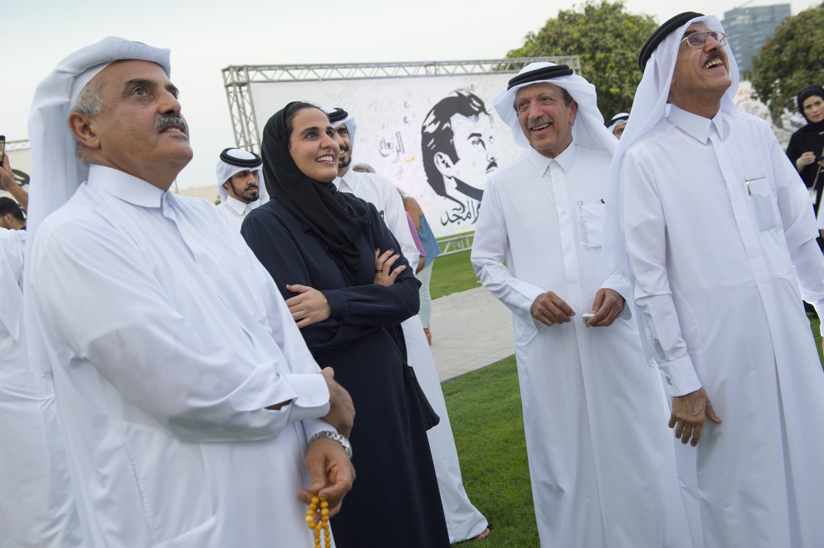 Qatar Museums (QM) Chairperson H E Sheikha Al Mayassa bint Hamad bin Khalifa Al Thani with other officials during the opening night tour of the “Tamim Al Majd: Celebration of Unity” exhibition at MIA Park, yesterday.