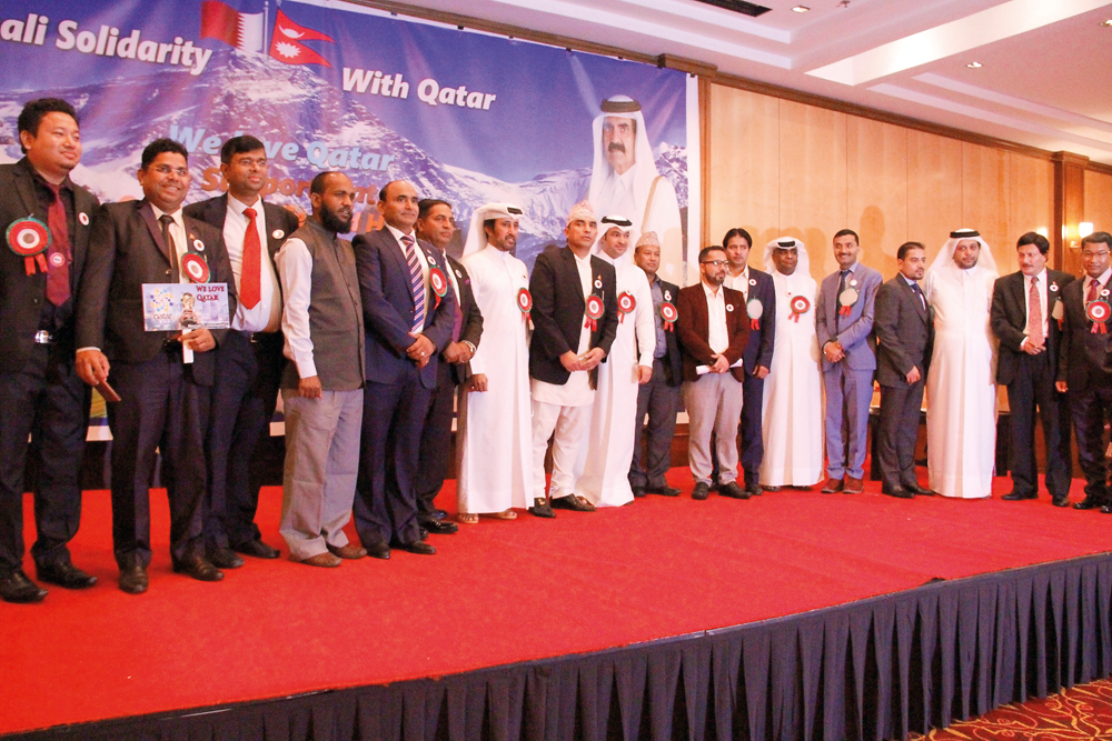 Nepali community members and other officials pose for a group picture. 