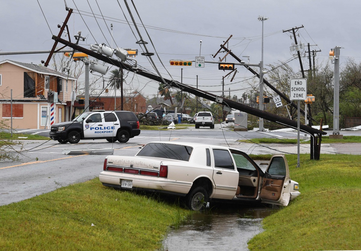 A lies abandoned after heavy damage when Hurricane Harvey hit Rockport, Texas on August 26, 2017. Hurricane Harvey slammed into the Texas coast late Friday, unleashing torrents of rain and packing powerful winds, the first major storm to hit the US mainla