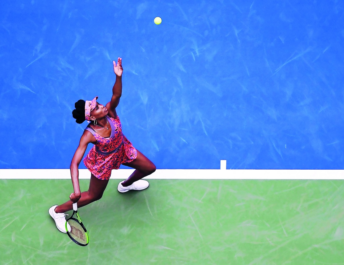 Venus Williams of the USA serves  to Viktoria Kuzmova of Slovakia in Ashe Stadium during their US Open match at the USTA Billie Jean King National Tennis Center on Monday. Williams won  6-3, 3-6, 6-2.