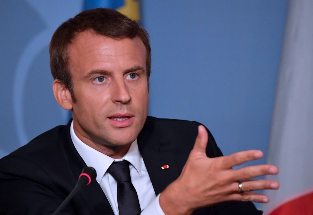 French President Emmanuel Macron (L) gives a press conference with Luxembourg's and Belgium's Prime Minister at Senningen Castle in Luxembourg on August 29, 2017. / AFP / Christian LIEWIG
