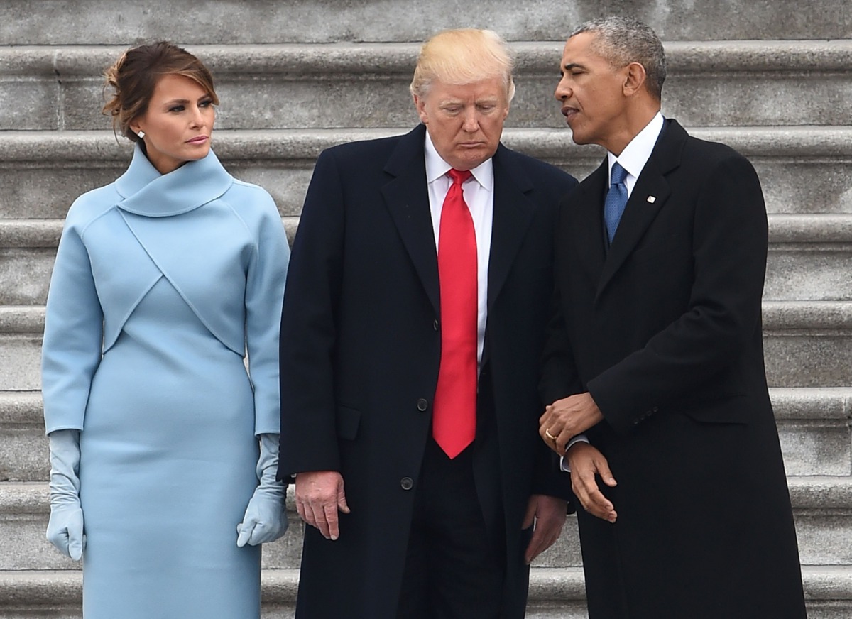 FILE PHOTO: US President Donald Trump speaks to former President Barack Obama as First Lady Melania Trump looks on after inauguration ceremonies at the US Capitol on January 20, 2017 in Washington (AFP / Robyn BECK) 