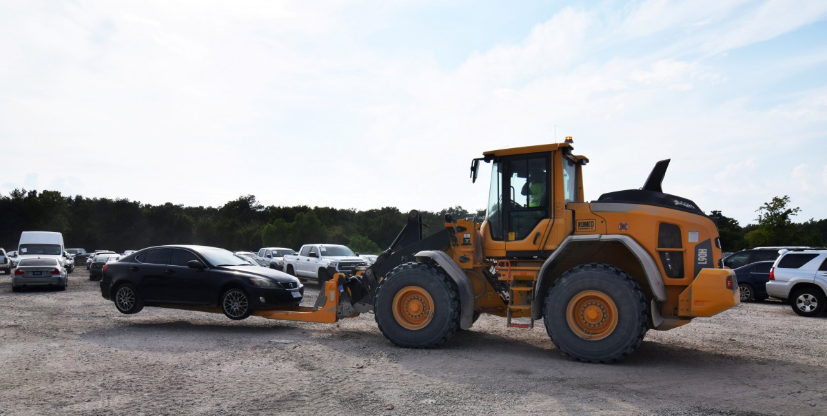 A forklift moves a car damaged by Hurricane Harvey at a local staging area run by Insurance Auto Auctions Inc, which has launched a major operation to process damaged cars for its insurance company customer base in Houston, Texas, U.S. on September 5, 201