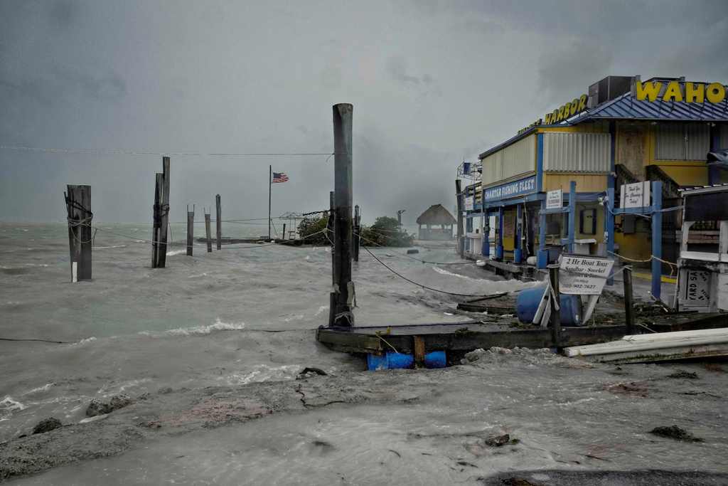 Rough surf churned up buy the approaching hurricane damage the docks at Whale harbour in the Florida Keys as winds and rain from the outer bands of Hurricane Irma arrive in Islamorada, Florida on September 9, 2017.  AFP / Gaston De Cardenas
