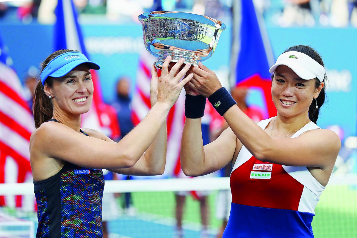 Martina Hingis of Switzerland and Chan Yung-Jan of Taiwan hold the championship trophy after defeating Lucie Hradecka and Katerina Siniakova both of Czech Republic after their Women’s Doubles finals match on Day Fourteen of the 2017 US Open at the USTA Bi
