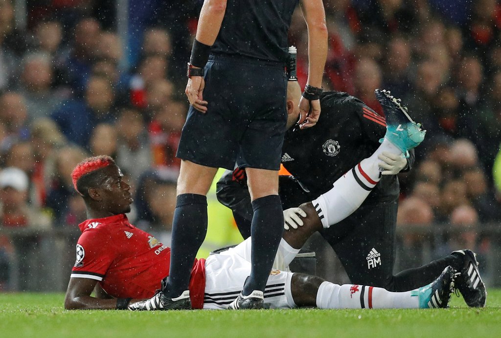 Manchester United's Paul Pogba receives medical attention after sustaining an injury REUTERS/Darren Staples
