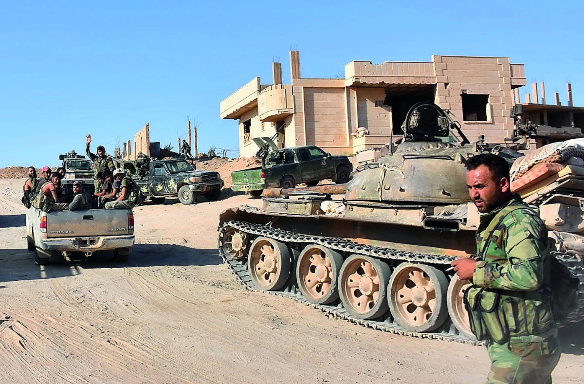 Syrian forces begin their advance on the area of Bughayliyah, on the northern outskirts of Deir Al Zor yesterday, during their ongoing battle against the Islamic State (IS) group.
