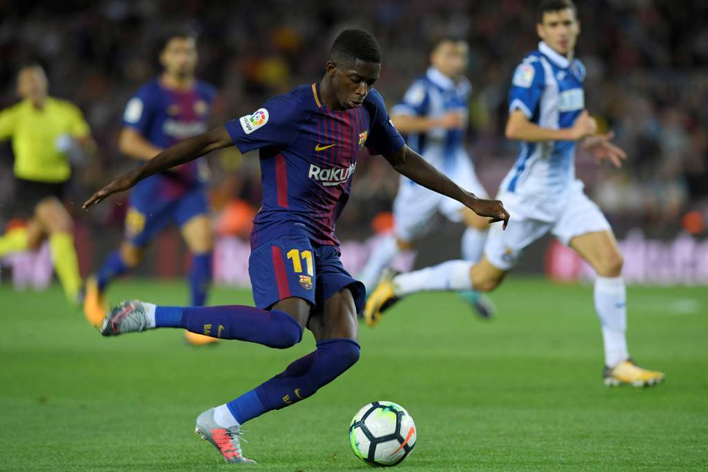 (FILES) This file photo taken on September 09, 2017 shows Barcelona's French forward Ousmane Dembele kicking the ball during the Spanish Liga football match Barcelona vs Espanyol at the Camp Nou stadium in Barcelona on September 9, 2017.  AFP / LLUIS GENE