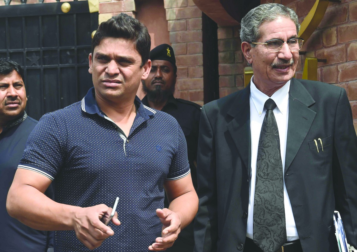 Pakistan cricketer Khalid Latif leaves after appearing before a tribunal in Lahore in this March 31 file photo. Pakistan cricket’s anti-corruption tribunal yesterday banned Latif for five years and fined him one million rupees ($9,489) over a spot-fixing 