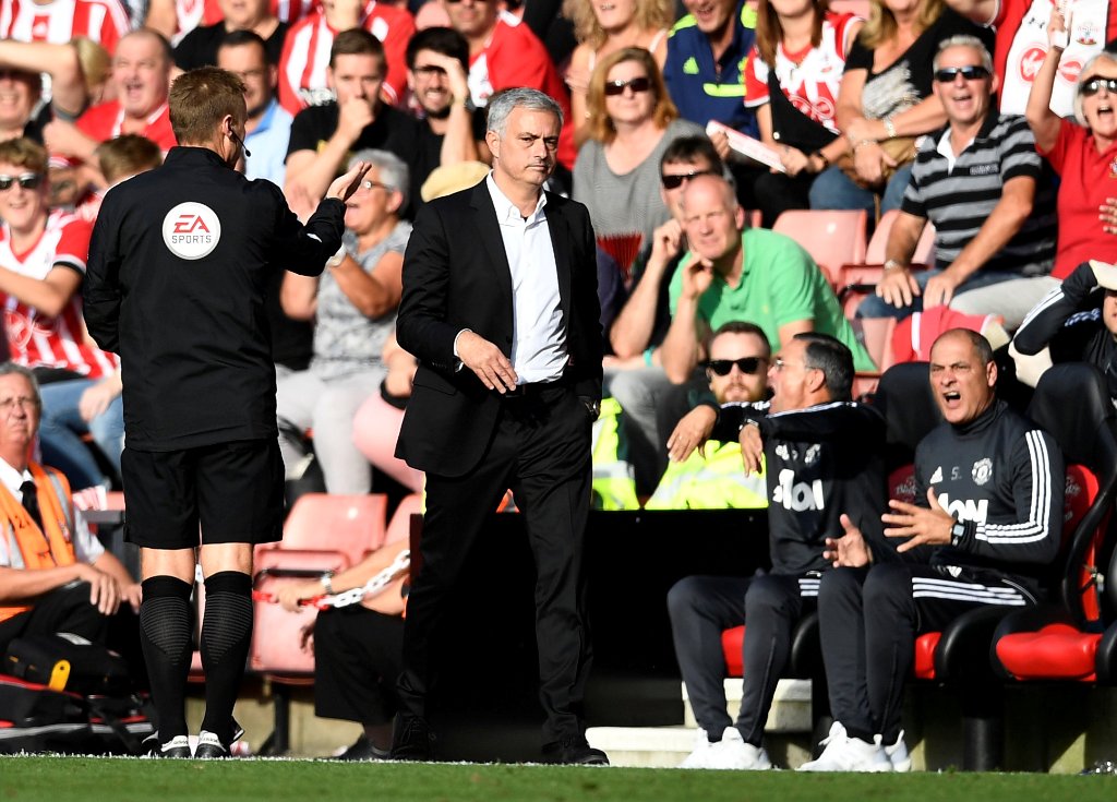 Manchester United manager Jose Mourinho is sent to the stands by referee Craig Pawson (not pictured) as fourth official Mike Jones looks on REUTERS/Dylan Martinez 
