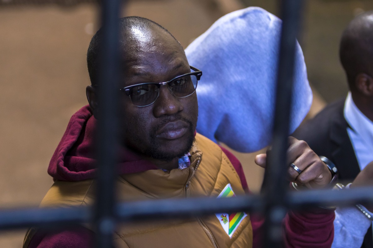 This file photo taken on June 28, 2017 shows Zimbabwean cleric and political activist Evan Mawarire arriving at the magistrate's court in Harare after he was detained for addressing and praying with striking University of Zimbabwe medical students. AFP / 